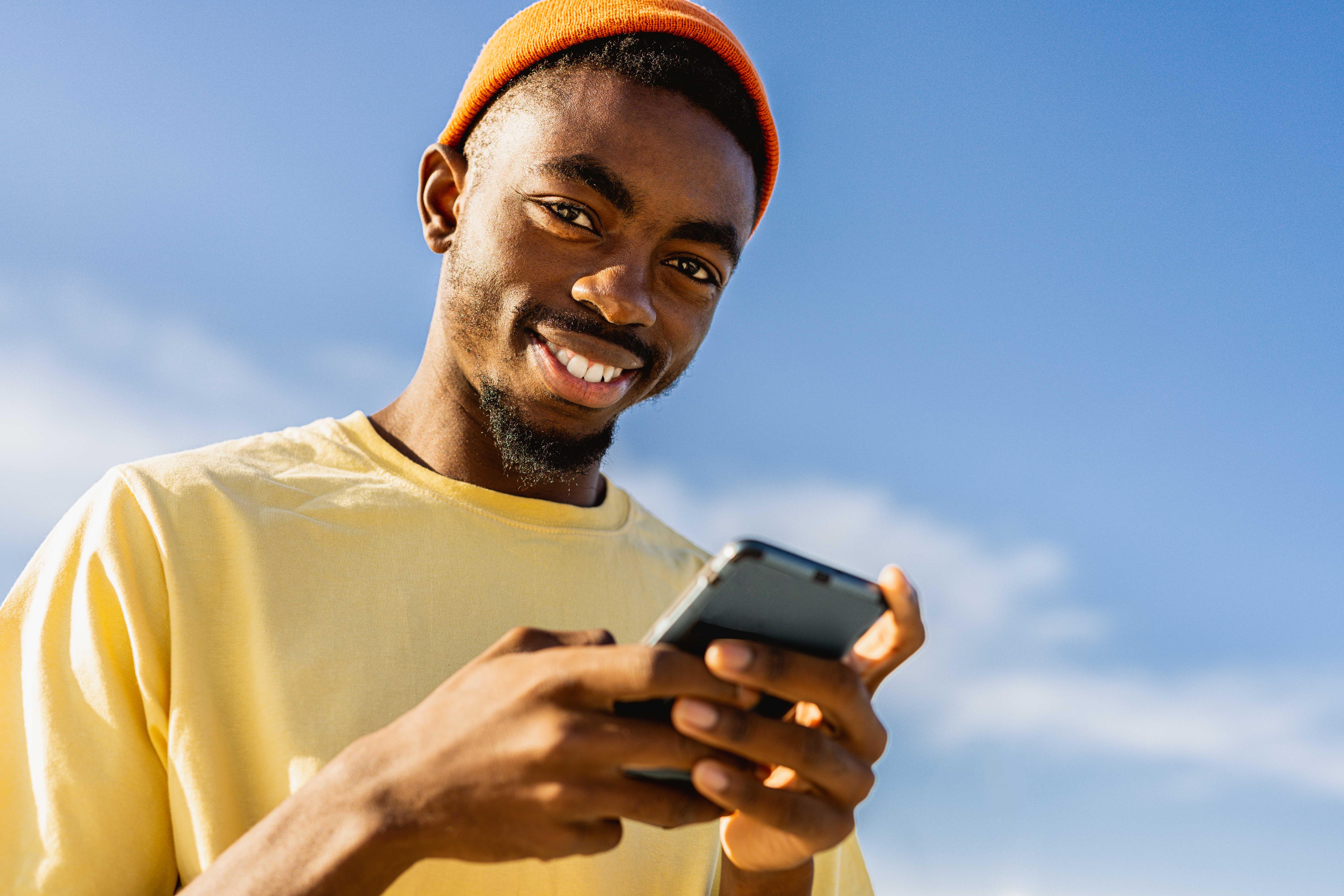 Person holding a phone and smiling